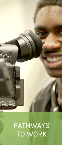 young man looking through camera - in color